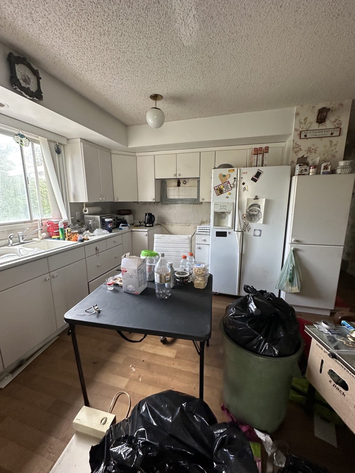 Cluttered kitchen we can buy as-is